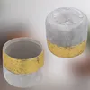 Two ceramic pots with a gold band, one upright and one upside down. Podgląd zdjęcia produktu