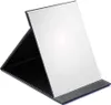 A black and white foldable makeup mirror is shown against a white background. Produktbild-Vorschau