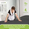 A hotel maid making a bed with dark grey sheets. Produktbild-Vorschau