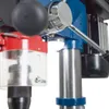 A close-up view of a drill press, focusing on the chuck guard, handle, and part of the motor. Produktbild-Vorschau