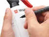 A hand is writing on a white spray bottle with a black marker. Náhled obrázku produktu