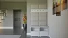 A hallway with a coat rack and shoe storage unit. Náhled obrázku produktu