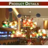 Christmas-themed window decorations with lights, hanging from suction cups. Produktbild-Vorschau