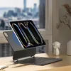 A tablet with a keyboard case is displayed on a wooden desk in front of a window with a city view. Anteprima dell’immagine prodotto
