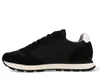 A side view of a black sneaker against a white background. Produktbild-Vorschau
