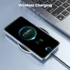 A smartphone is wirelessly charging on a charging pad next to a laptop. Produktbild-Vorschau