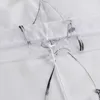 A close-up view of a white sheer curtain with embroidered details and ties. Produktbild-Vorschau