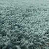 A close-up view of a shaggy rug. Produktbild-Vorschau