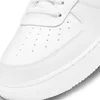 A close-up view of the toe area of a white Nike sneaker. Anteprima dell’immagine prodotto