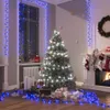 A decorated Christmas tree with presents underneath, surrounded by blue LED lights. Náhľad obrázku produktu