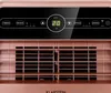 Close-up of the control panel and upper grille of a rose gold air conditioner. Náhled obrázku produktu