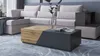 A modern living room scene featuring a sectional sofa and a coffee table. Náhled obrázku produktu