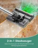 A close-up shot of a cordless vacuum cleaner head cleaning a floor with debris and a green light effect indicating cleaning action. Produktbild-Vorschau
