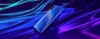A blue smartphone is displayed on a reflective, wavy surface with blue and purple lighting. Produktbild-Vorschau