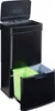 A black multi-compartment trash can with a lid open, showing two internal bins, one green and one gray. Voir les images du produit