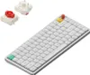 A white mechanical keyboard with some colorful keycaps and two separate key switches are shown on a white background. Produktbild-Vorschau