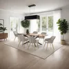 A dining room with a table and chairs, set up for a meal. Náhled obrázku produktu