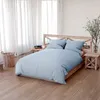 A bedroom scene with a bed, nightstands, and curtains. Anteprima dell’immagine prodotto
