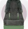 A close-up view of a green baby stroller footmuff with a gray fleece lining and faux fur trim. Náhľad obrázku produktu
