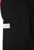 A close-up view of a black fabric product with a label and a hook attached. Náhled obrázku produktu