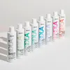 A row of Indola shampoo bottles displayed on a white surface with a light gray background. Produktbild-Vorschau