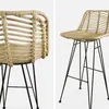 Two bar stools made of rattan and metal. Anteprima dell’immagine prodotto