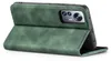 A green flip case for a smartphone is shown from a side angle, with the front cover open and folded back. Produktbild-Vorschau