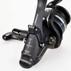 A close-up studio shot of a black fishing reel against a white background. Produktbild-Vorschau