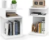 Two white S-shaped side tables are shown against a white background. The table on the left has books, a plant, and a teapot. The table on the right has books, pens, and a clock. Podgląd zdjęcia produktu