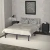 A bedroom scene with a bed, nightstands, and wall art. Náhled obrázku produktu