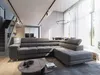 A modern living room with a large sectional sofa, coffee table, and dining area in the background. Produktbild-Vorschau