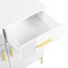 A close-up view of an open drawer on a white dresser with gold handles. Anteprima dell’immagine prodotto