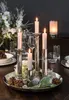 A table setting with a centerpiece of candles and decorative elements. Produktbild-Vorschau