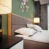 A bedroom scene with a bed, nightstand, and decorative mirror. Náhled obrázku produktu
