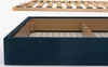 A close-up view of a bed frame and its wooden slats. Produktbild-Vorschau
