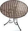 A round metal table with a decorative floral pattern on the tabletop and three curved legs. Produktbild-Vorschau