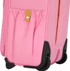 A close-up view of the bottom corner of a pink suitcase, showing the wheels and a pocket with a small yellow tag. Produktbild-Vorschau
