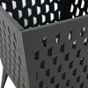 A close-up view of a black metal fire pit with a perforated design. Náhled obrázku produktu