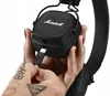 A hand is plugging a USB-C cable into a black Marshall Major IV headphone. Náhľad obrázku produktu