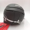 A black ski helmet with white accents and branding, shown from the back. Náhled obrázku produktu