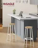 A modern kitchen island with two bar stools in front of it. Produktbild-Vorschau