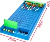 A blue Mastermind game board with colorful pegs and a green divider, shown with dimensions indicated. Anteprima dell’immagine prodotto