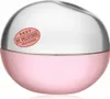 A close-up studio shot of a DKNY Be Delicious Fresh Blossom Eau de Parfum spray bottle. Podgląd zdjęcia produktu
