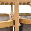 A close-up view of the bamboo frame and fabric baskets of a laundry sorter. Produktbild-Vorschau