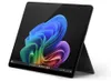 A black tablet with a colorful abstract wallpaper displayed on its screen, propped up by its kickstand. Produktbild-Vorschau