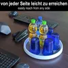 A rotating organizer tray with bottles of liquid and glasses on a wooden desk next to computer peripherals. Produktbild-Vorschau