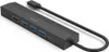 A black USB-C hub with multiple ports is shown against a white background. Náhled obrázku produktu