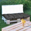 Outdoor seating area with pallet furniture and cushions. Anteprima dell’immagine prodotto