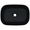 A top-down view of a black ceramic sink with a drain hole in the center. Náhľad obrázku produktu