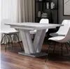 A dining table with chairs in a dining room setting. Anteprima dell’immagine prodotto
